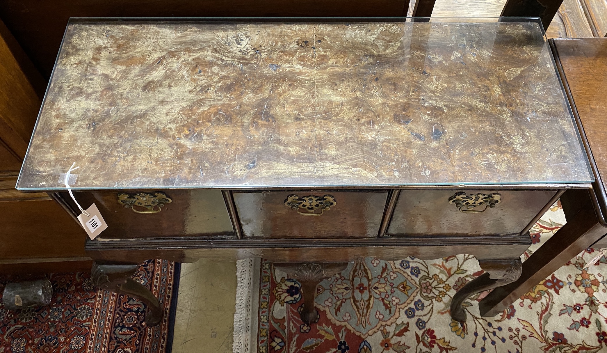 A Queen Anne style walnut three drawer side table, possibly an adapted stand, width 91cm, depth 38cm, height 77cm